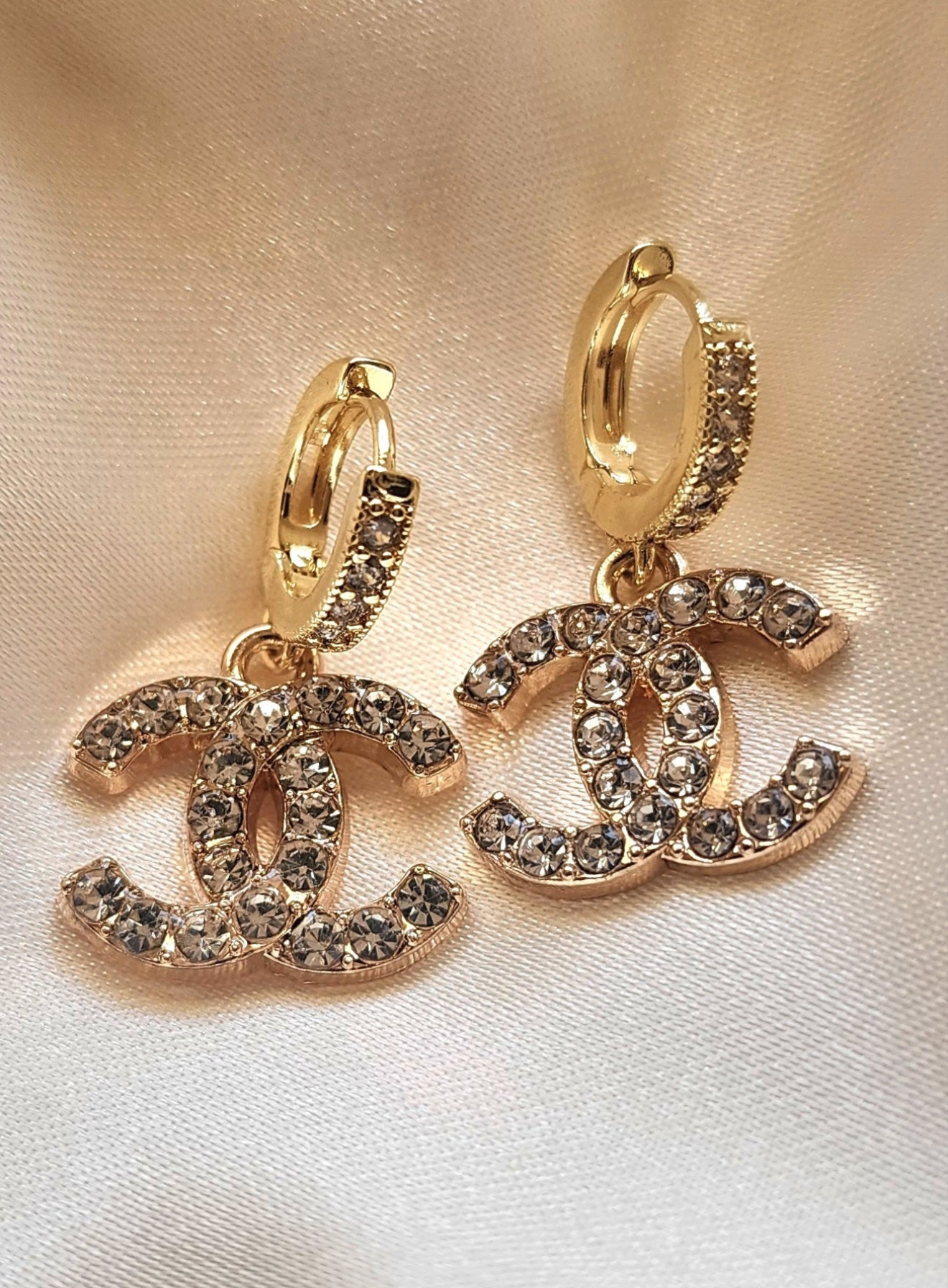 Repurposed vintage crystal button charms earrings from the CC Era Collection, featuring crystal-embedded charms on solid Sterling Silver 925 gold vermeil huggie hoops.