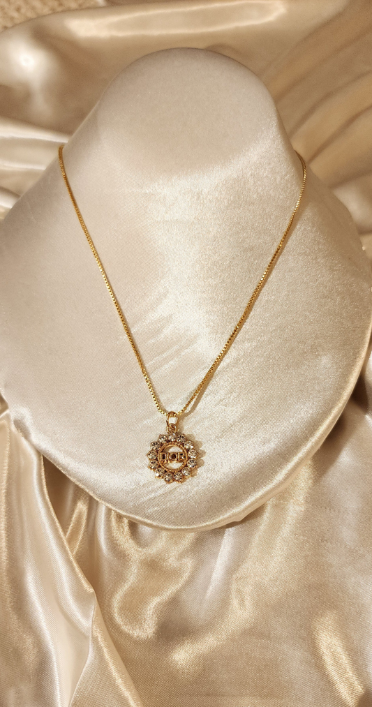 Repurposed vintage charm necklace from DR Era Collection with a crystal pendant and a solid sterling silver chain plated in gold vermeil.