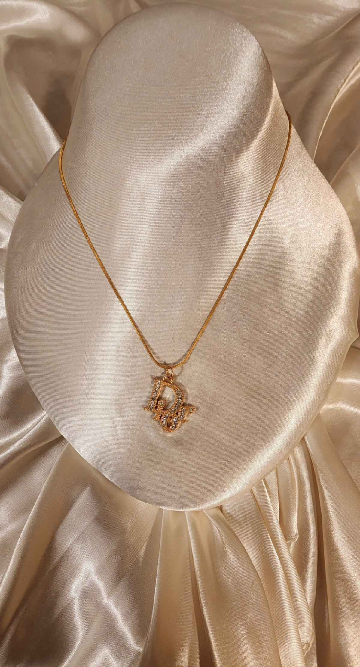 Repurposed vintage charm necklace from DR Era Collection with a crystal embedded pendant and a solid sterling silver chain plated in gold vermeil.