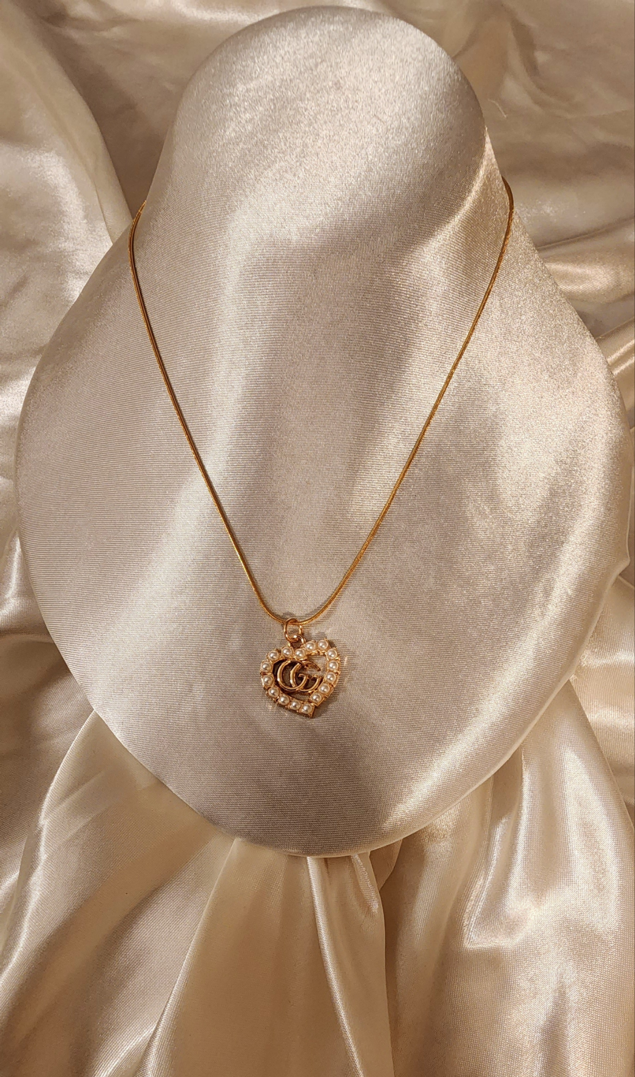 Repurposed vintage charm necklace from GG Era Collection a mini gold-tone pendant on a solid sterling silver chain plated in gold vermeil.