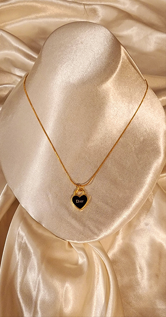 Repurposed vintage charm necklace from DR Era Collection with a delicate gold-tone pendant and a solid sterling silver chain plated in gold vermeil.